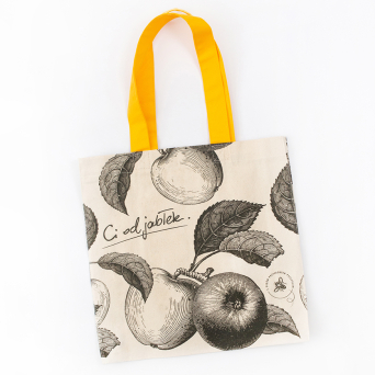 Custom Bracia Sadownicy tote bag with an apple print on natural cotton and sunny yellow handles.