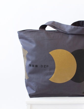 Discreet branding, elevated detailing — the DZP tote in elegant gray