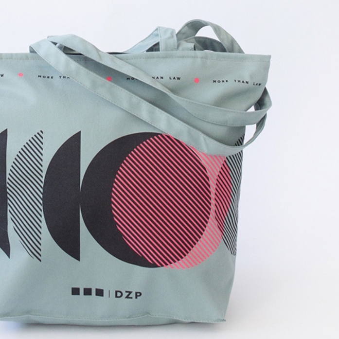 Premium cotton totes for DZP: sage/gray, double handles, zipper, lining, gold print. Elegance, function, and brand prestige — crafted by Mart’s Bags.