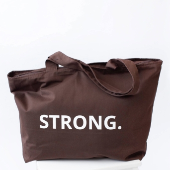 Front view of brown STRONG. tote bag